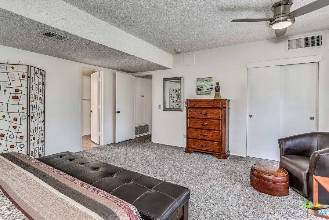 1855 Ramon Road, Unit 3 Palm Springs, CA 92264 - Photo 18 of 38 a living room with furniture and a walk in closet