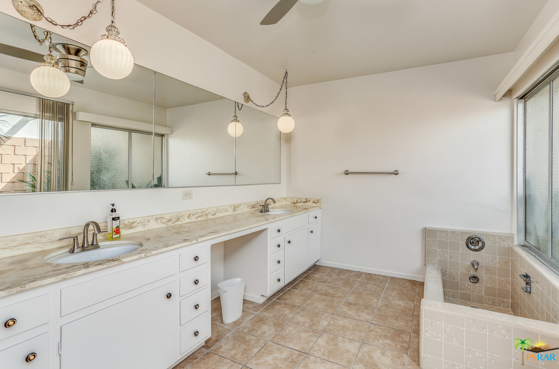 1855 Ramon Road, Unit 3 Palm Springs, CA 92264 - Photo 20 of 38 a spacious bathroom with a tub sink and mirror