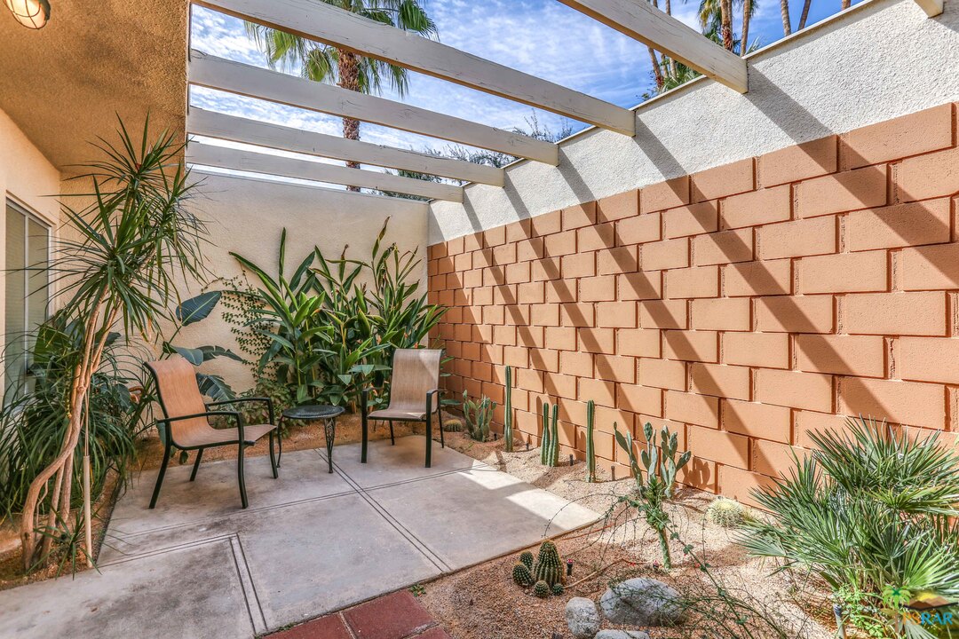 1855 Ramon Road, Unit 3 Palm Springs, CA 92264 - Photo 22 of 38 a view of a backyard
