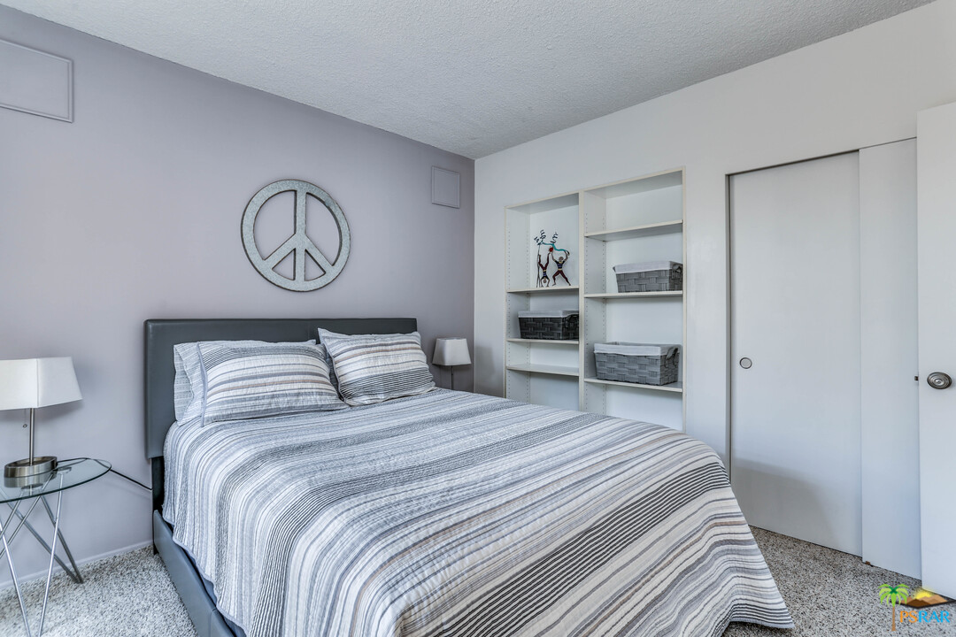 1855 Ramon Road, Unit 3 Palm Springs, CA 92264 - Photo 25 of 38 a bedroom with a bed and a lamp on dresser