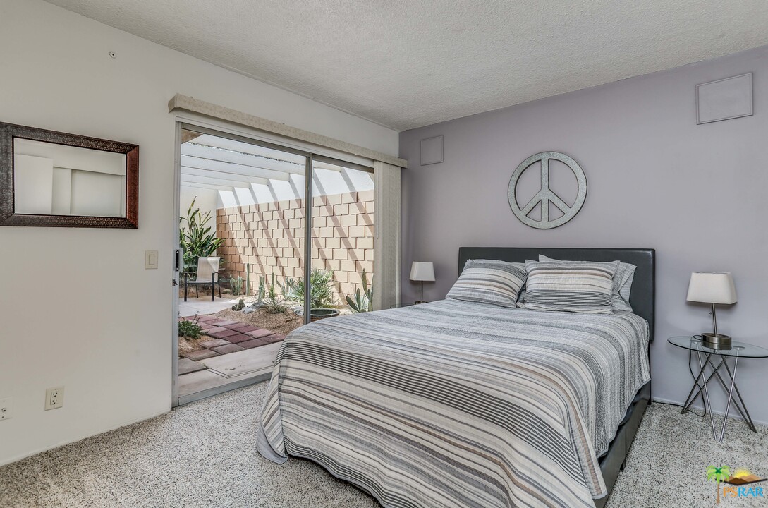 1855 Ramon Road, Unit 3 Palm Springs, CA 92264 - Photo 27 of 38 a bedroom with a bed and a window