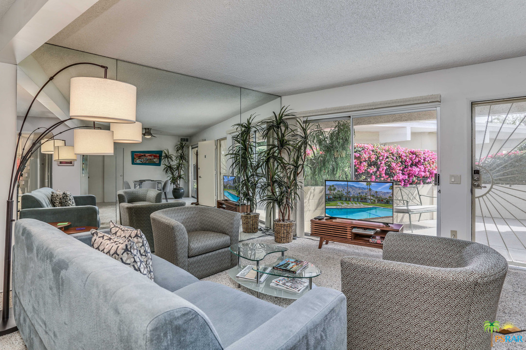 1855 Ramon Road, Unit 3 Palm Springs, CA 92264 - Photo 6 of 38 a living room with furniture flowerpot and a potted plant