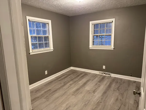 an empty room with windows