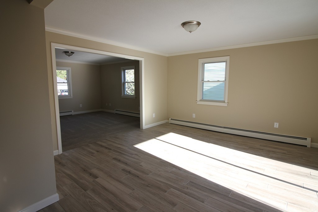 104 Sunapee Street Springfield, MA 01108 - Photo 3 of 11 a view of an empty room and window