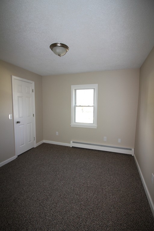 104 Sunapee Street Springfield, MA 01108 - Photo 7 of 11 an empty room with a window