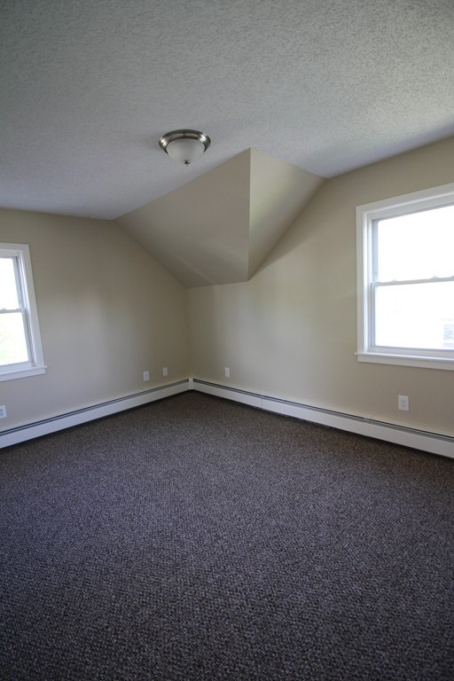 104 Sunapee Street Springfield, MA 01108 - Photo 8 of 11 an empty room with a window