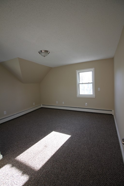 104 Sunapee Street Springfield, MA 01108 - Photo 9 of 11 a view of an empty room and window