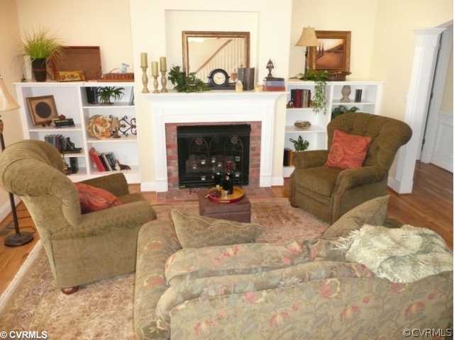 14131 Riverdowns S Drive Midlothian, VA 23113 - Photo 5 of 11 a living room with furniture and a fireplace