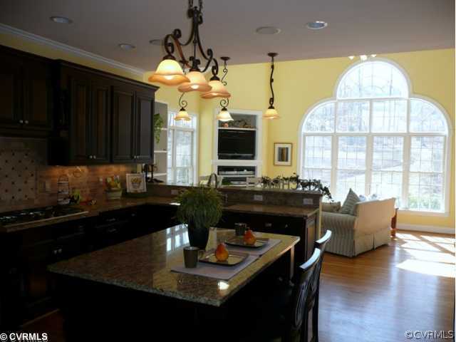 14131 Riverdowns S Drive Midlothian, VA 23113 - Photo 9 of 11 a kitchen with a table chairs stove and refrigerator