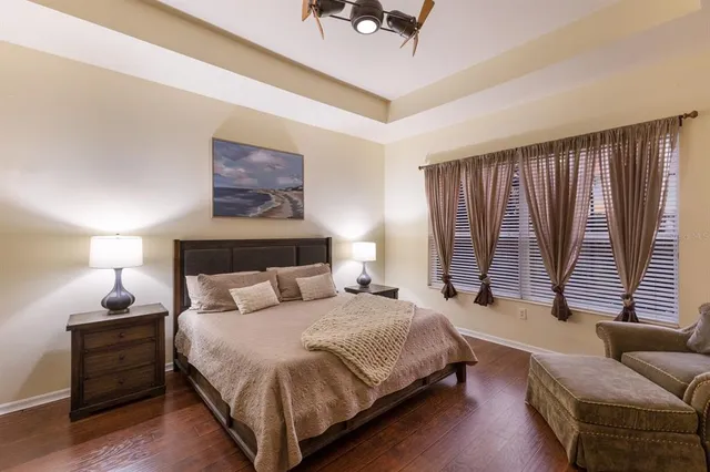 a bedroom with bed and window