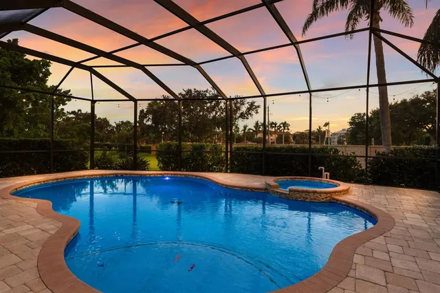 a view of swimming pool with a patio