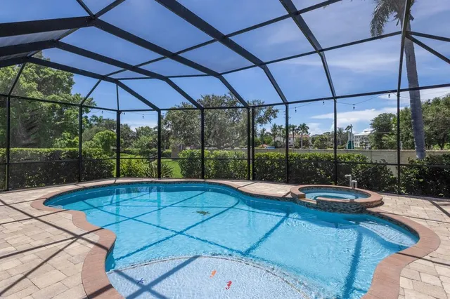 a view of a swimming pool with a porch