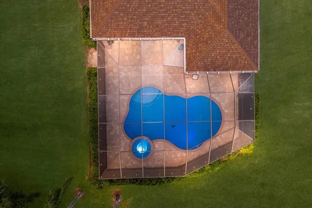 a aerial view of a house with a yard