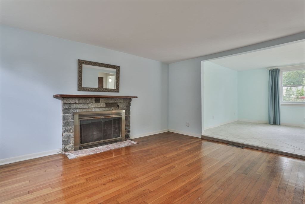 32 Silver Hill Road Maynard, MA 01754 - Photo 14 of 34 a view of empty room with wooden floor and fireplace
