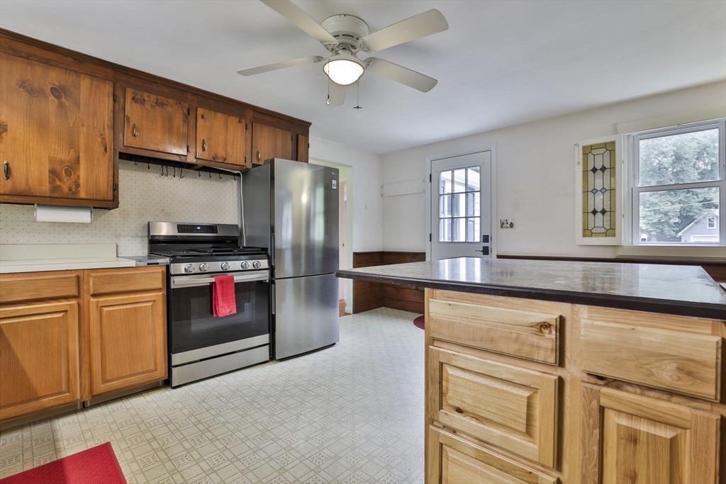 32 Silver Hill Road Maynard, MA 01754 - Photo 21 of 34 a kitchen with stainless steel appliances granite countertop a refrigerator and a sink