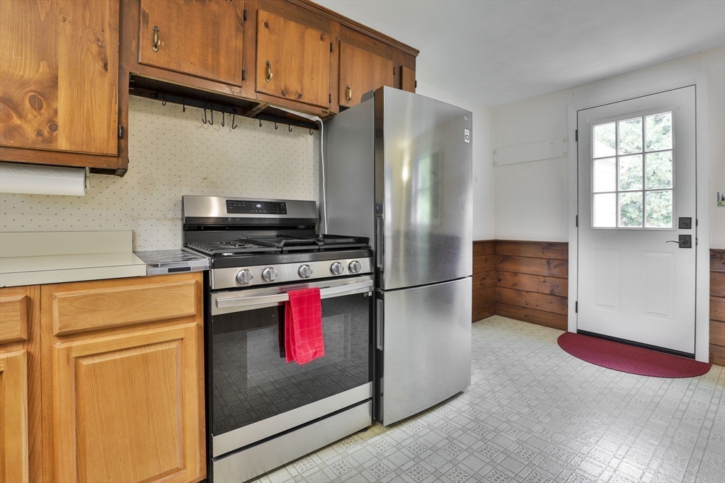 32 Silver Hill Road Maynard, MA 01754 - Photo 22 of 34 a kitchen with stainless steel appliances granite countertop a refrigerator stove and sink