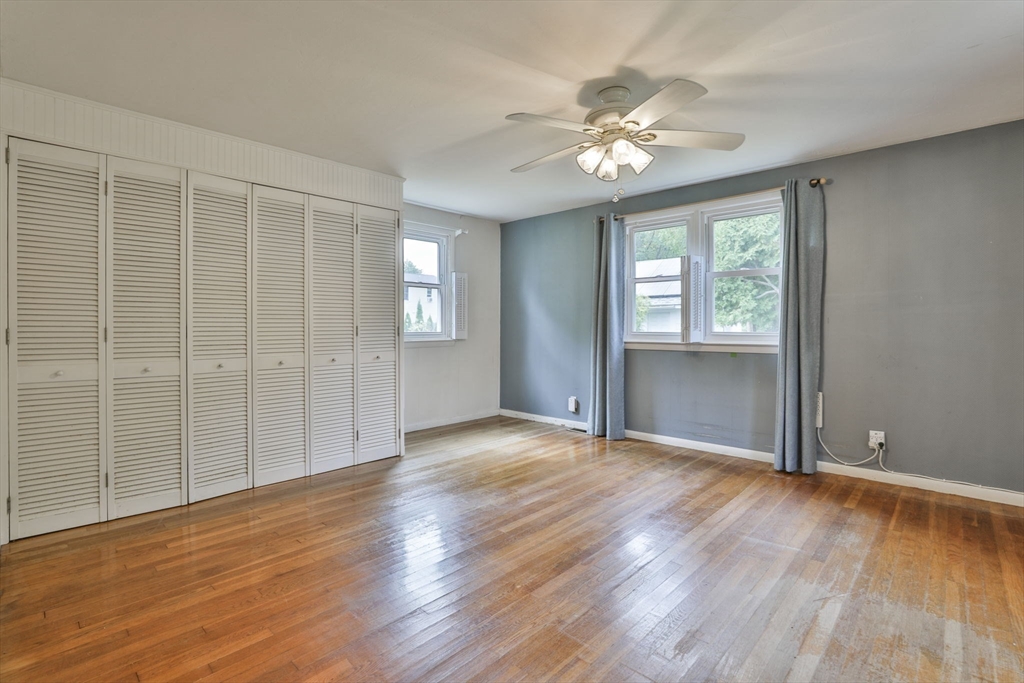 32 Silver Hill Road Maynard, MA 01754 - Photo 23 of 34 a view of an empty room with wooden floor and a window