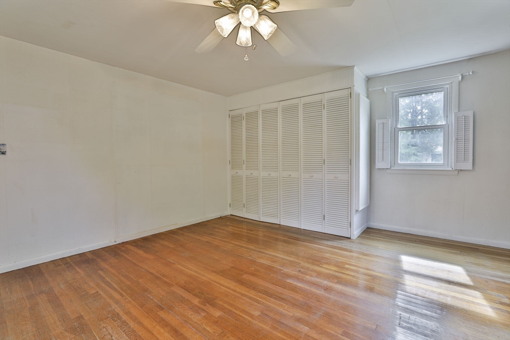32 Silver Hill Road Maynard, MA 01754 - Photo 25 of 34 an empty room with wooden floor and windows