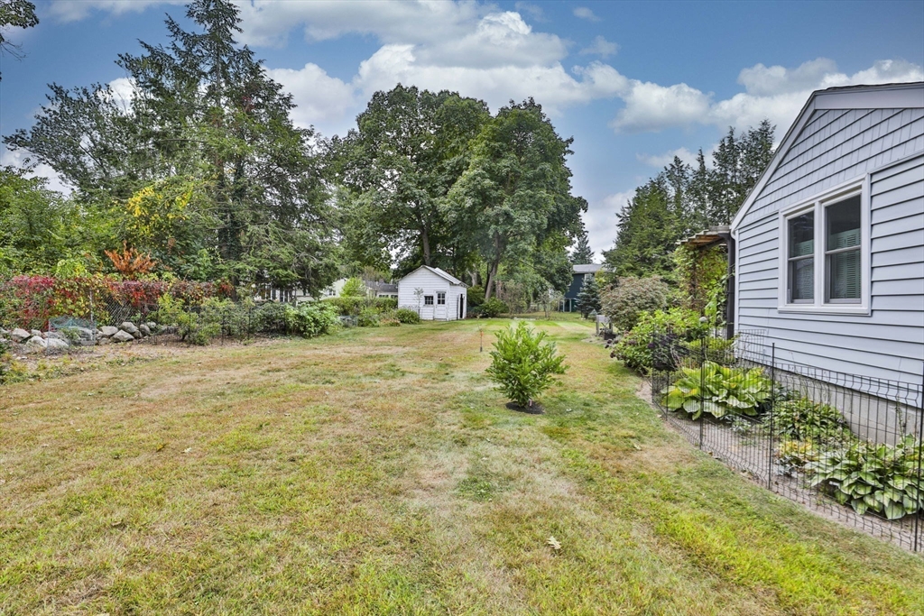 32 Silver Hill Road Maynard, MA 01754 - Photo 32 of 34 a view of a yard with plants and trees
