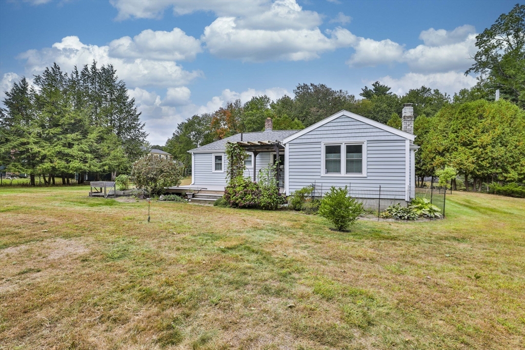 32 Silver Hill Road Maynard, MA 01754 - Photo 5 of 34 a view of a house with a yard and garage