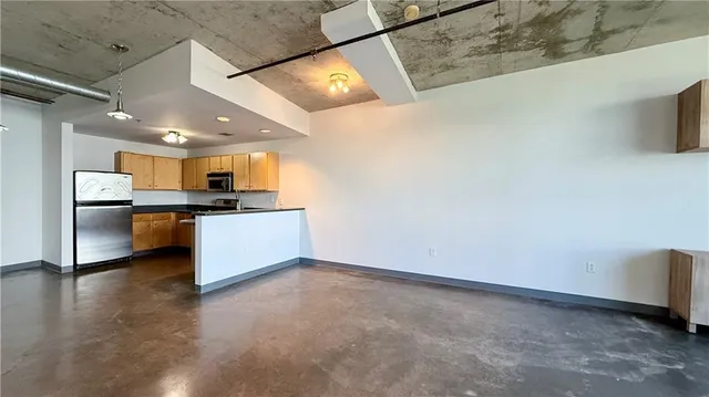 a view of a kitchen with a sink and an oven