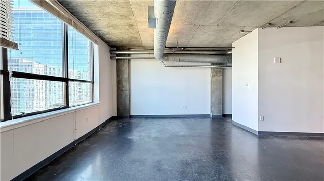 a view of a refrigerator in kitchen and wooden floor