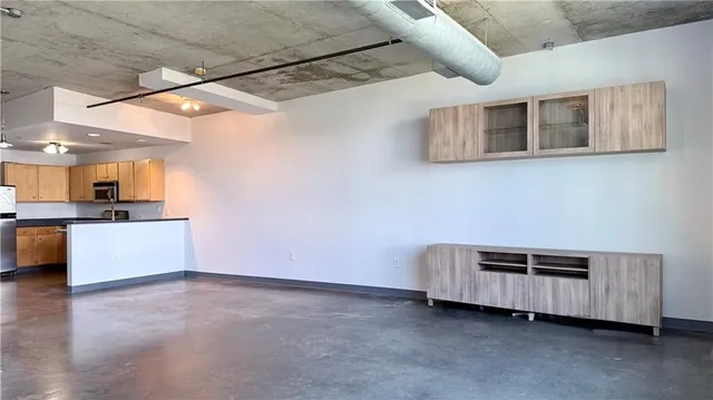 a view of a livingroom with a kitchen