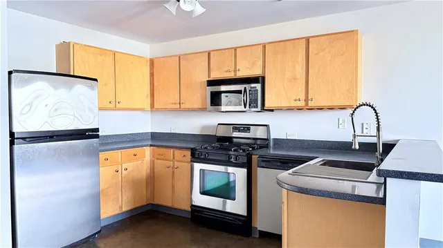 a kitchen with a stove and a microwave