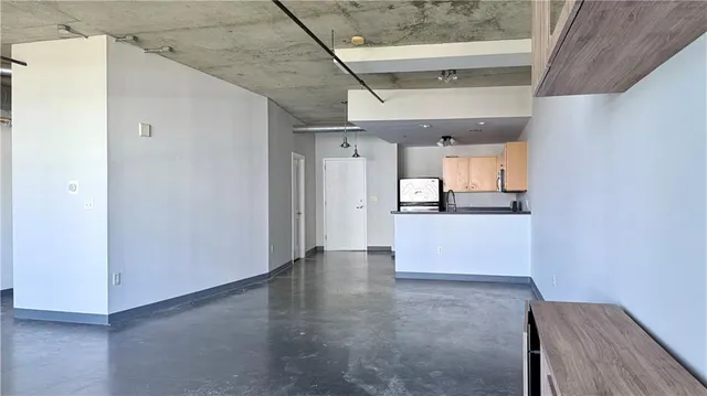a view of a kitchen with a dishwasher and cabinets