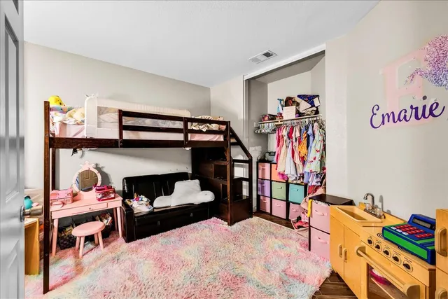 a bedroom with furniture and a bed