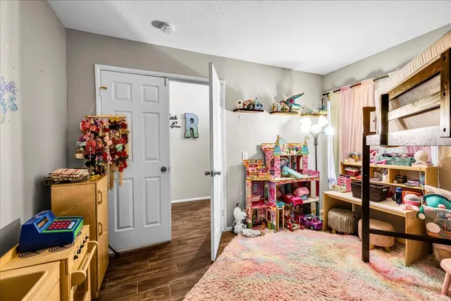 a view of a room with wooden floor and stuff
