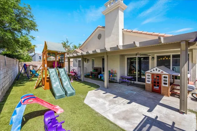 a view of yard with patio