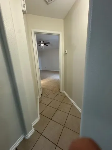 a view of a livingroom with a ceiling fan