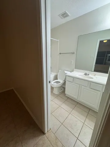 a kitchen with a sink a stove and a refrigerator