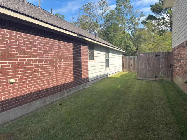 a backyard of a house with lots of green space