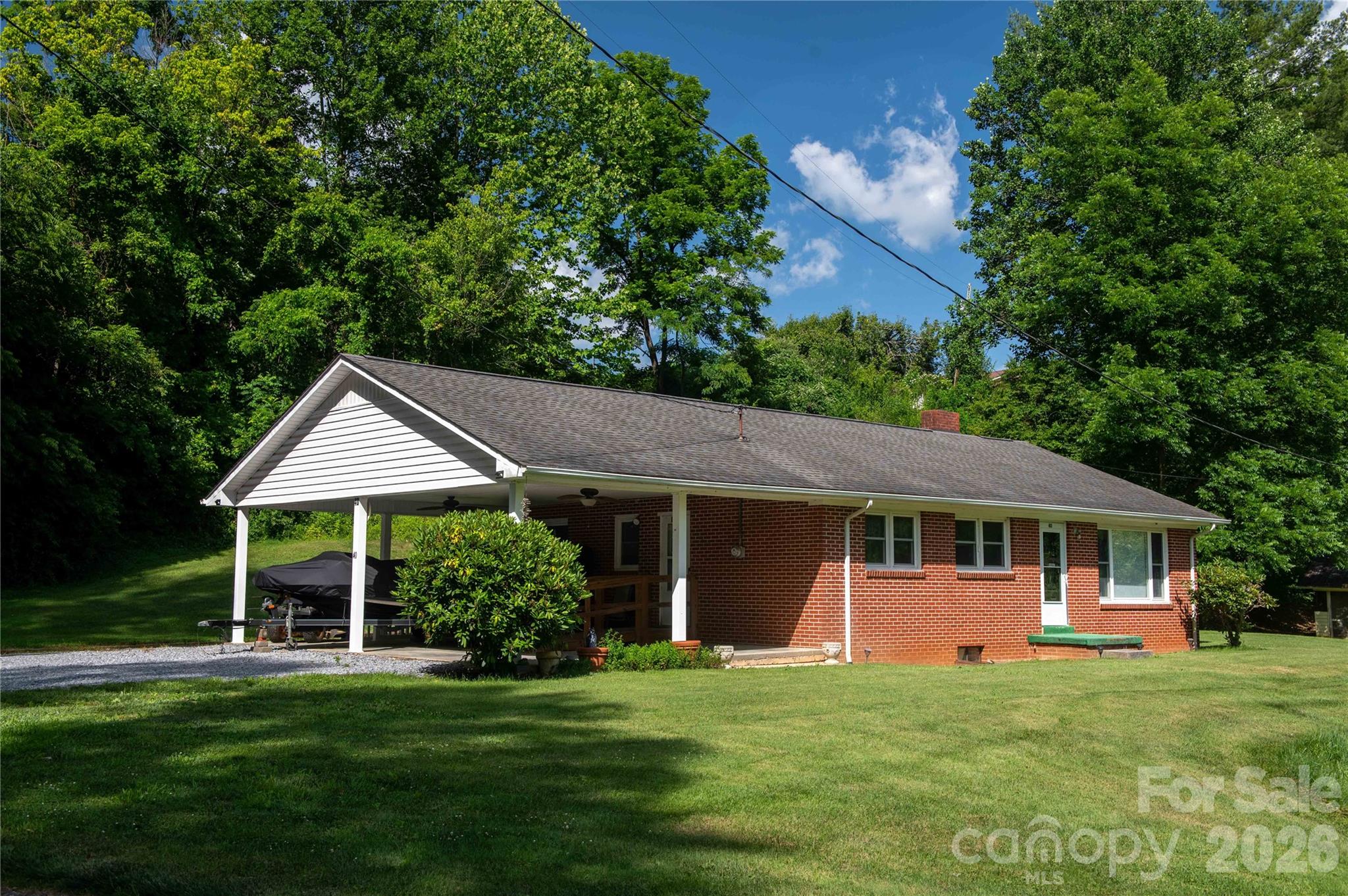 40 Double Island Road Burnsville, NC 28714 - Photo 1 of 38 a front view of a house with a garden