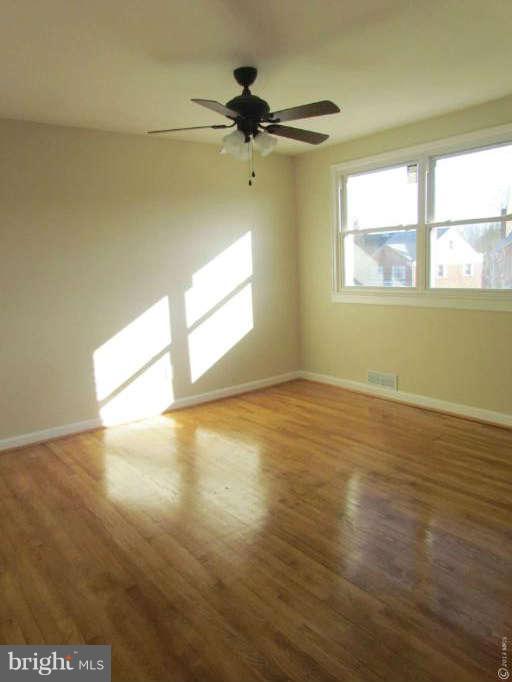 1808 Burnwood Road Baltimore, MD 21239 - Photo 16 of 25 a view of an empty room with a window