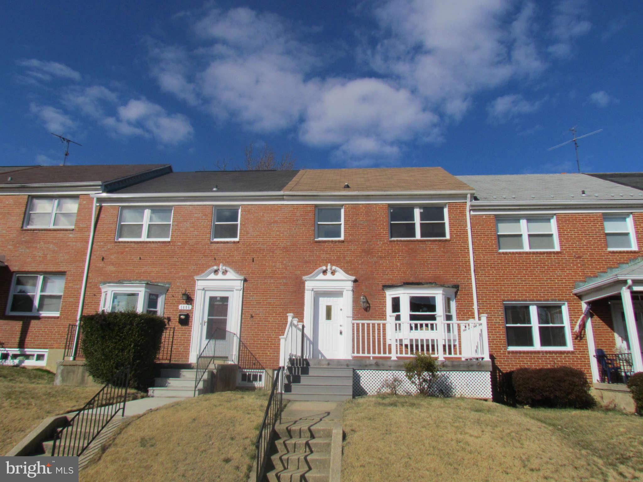 1808 Burnwood Road Baltimore, MD 21239 - Photo 25 of 25 a front view of a house with yard