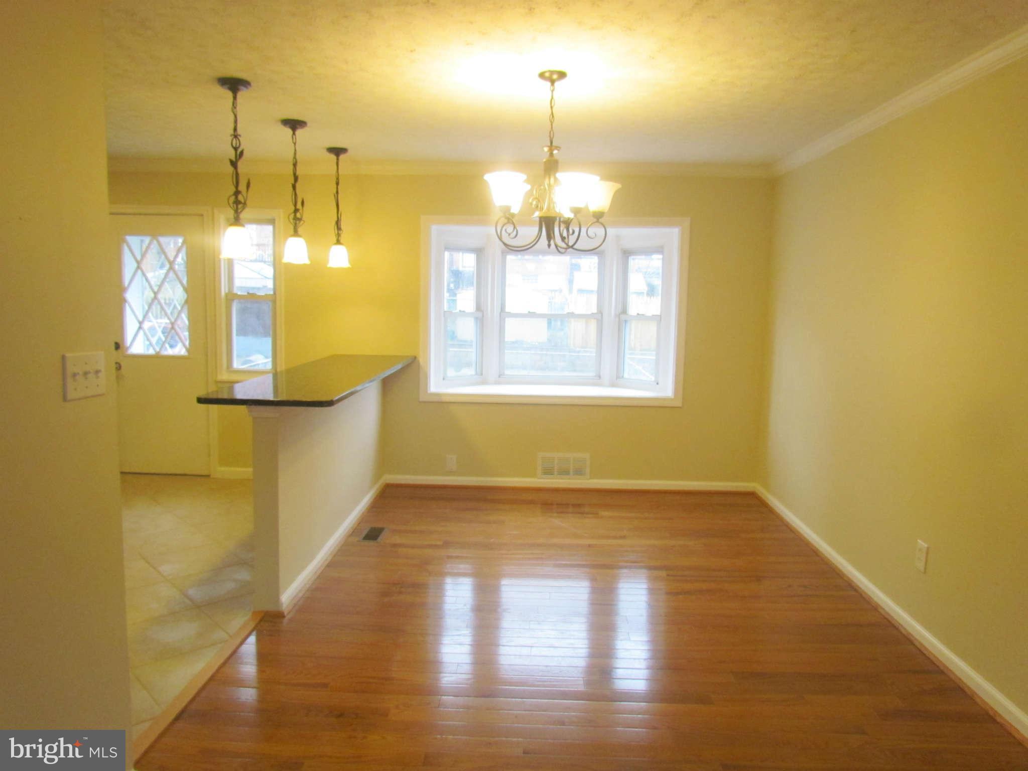 1808 Burnwood Road Baltimore, MD 21239 - Photo 6 of 25 a view of a room with window
