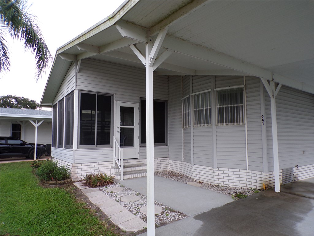 941 Wren Circle Sebastian, FL 32976 - Photo 1 of 16 a front view of a house with garden