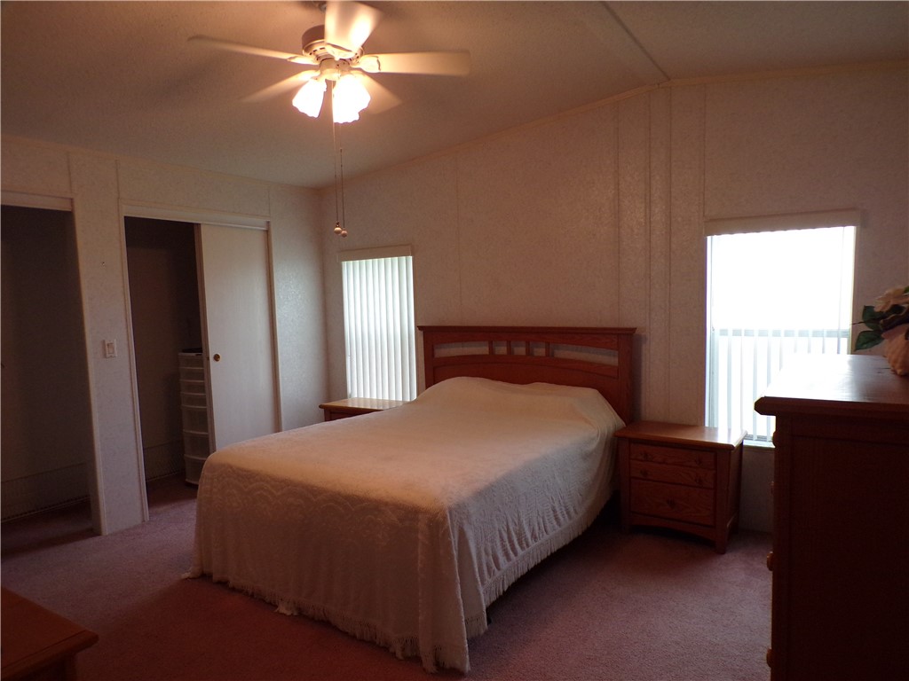 941 Wren Circle Sebastian, FL 32976 - Photo 11 of 16 a bedroom with a bed and window