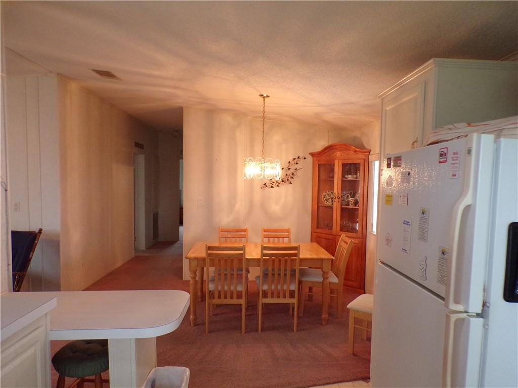 941 Wren Circle Sebastian, FL 32976 - Photo 3 of 16 a dining room with furniture and window