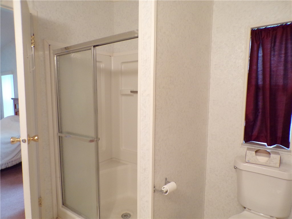 941 Wren Circle Sebastian, FL 32976 - Photo 7 of 16 a bathroom with a shower and a sink