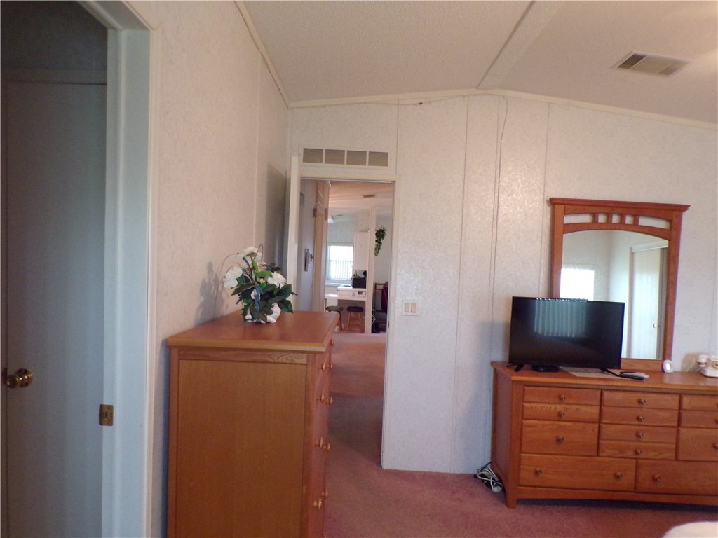 941 Wren Circle Sebastian, FL 32976 - Photo 9 of 16 a living room with furniture and a flat screen tv