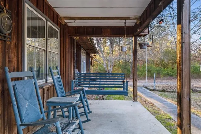 an empty room with furniture and a fireplace