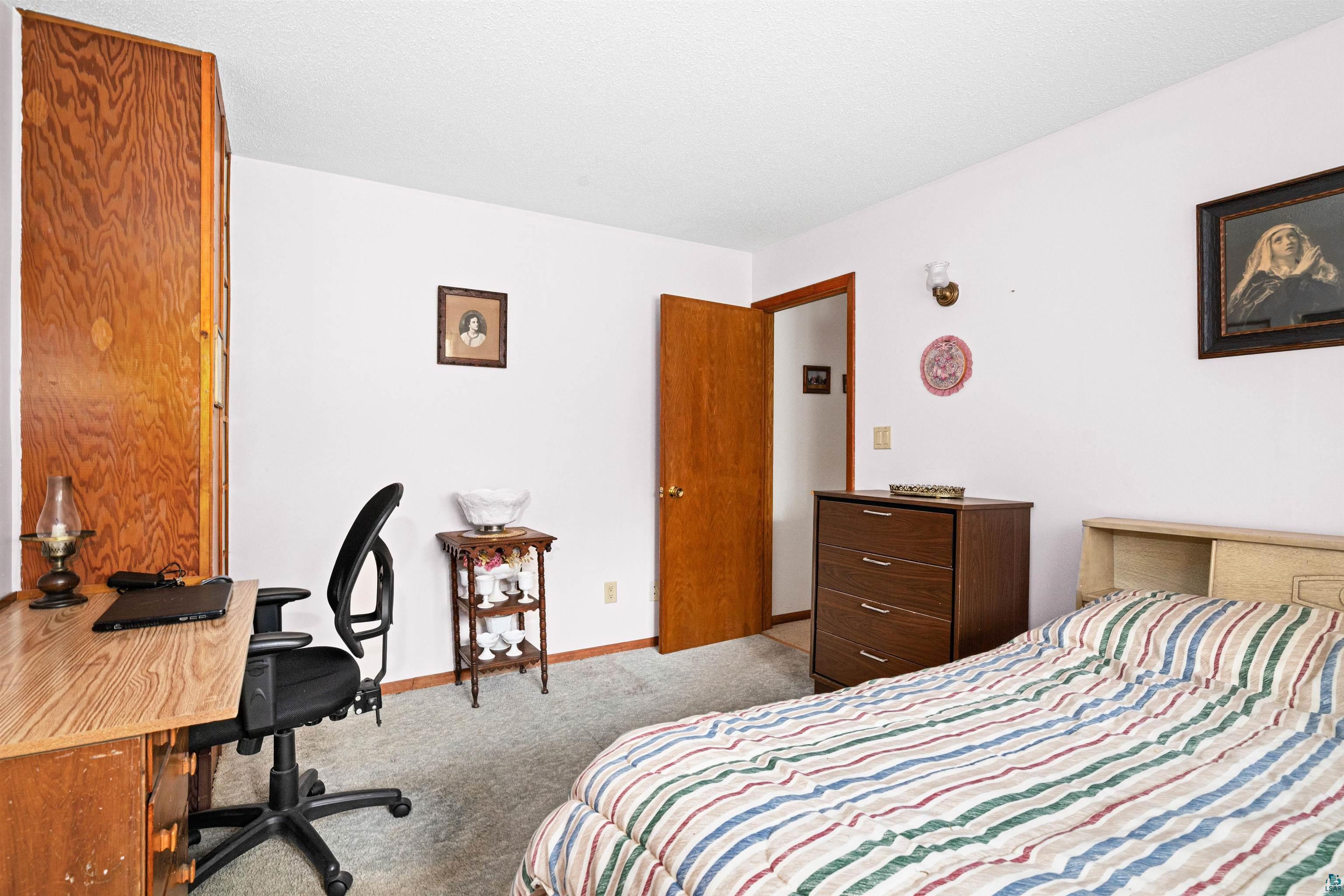 6242 State Highway 1 Silver Bay, MN 55614 - Photo 13 of 43 Bedroom with carpet, baseboards, and an office area