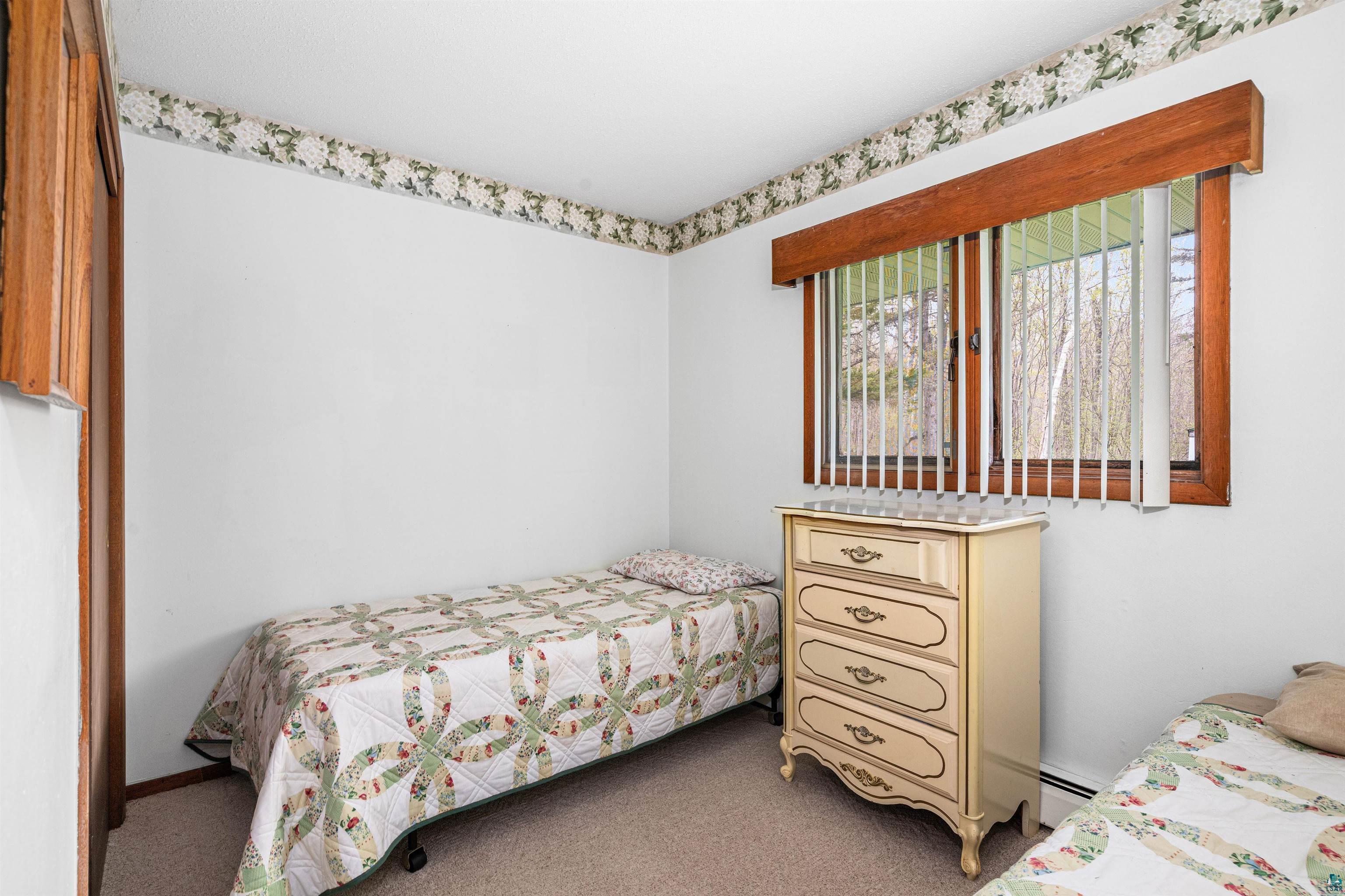 6242 State Highway 1 Silver Bay, MN 55614 - Photo 15 of 43 Carpeted bedroom featuring baseboard heating