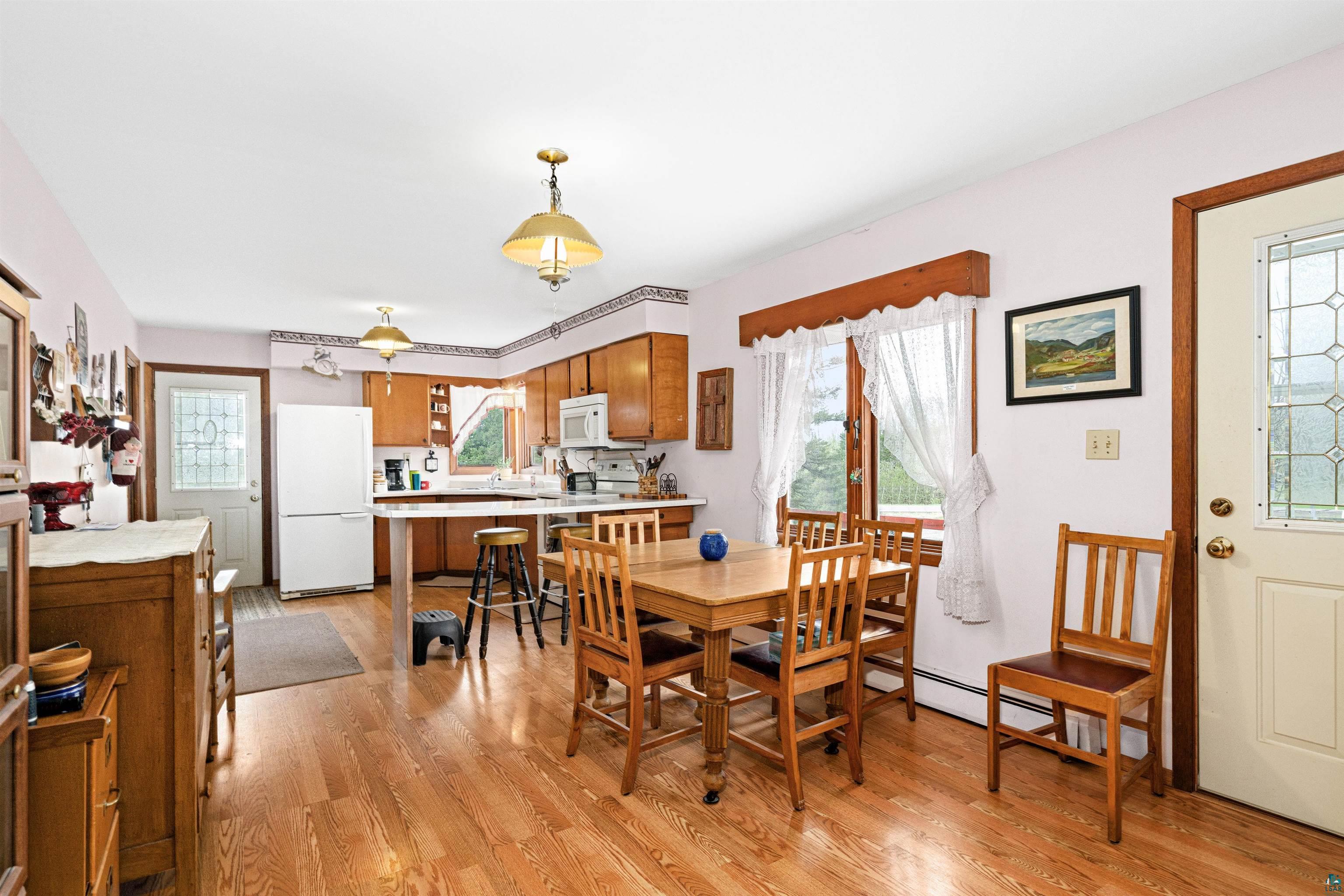 6242 State Highway 1 Silver Bay, MN 55614 - Photo 9 of 43 Dining area with light wood-type flooring and a baseboard radiator