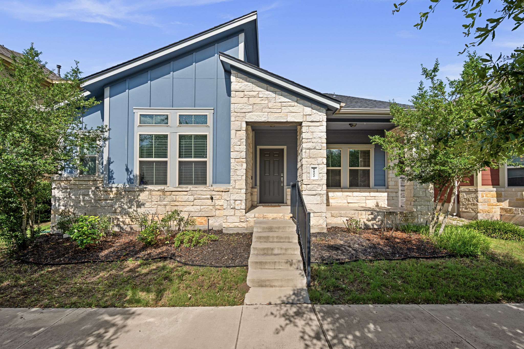 8800 Slater Drive Austin, TX 78747 - Photo 2 of 40 a front view of a house with a porch