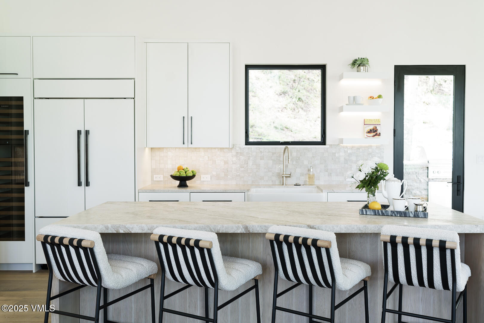 880 Forest Trail Edwards, CO 81632 - Photo 13 of 119 a kitchen with a dining table chairs and white stainless steel appliances